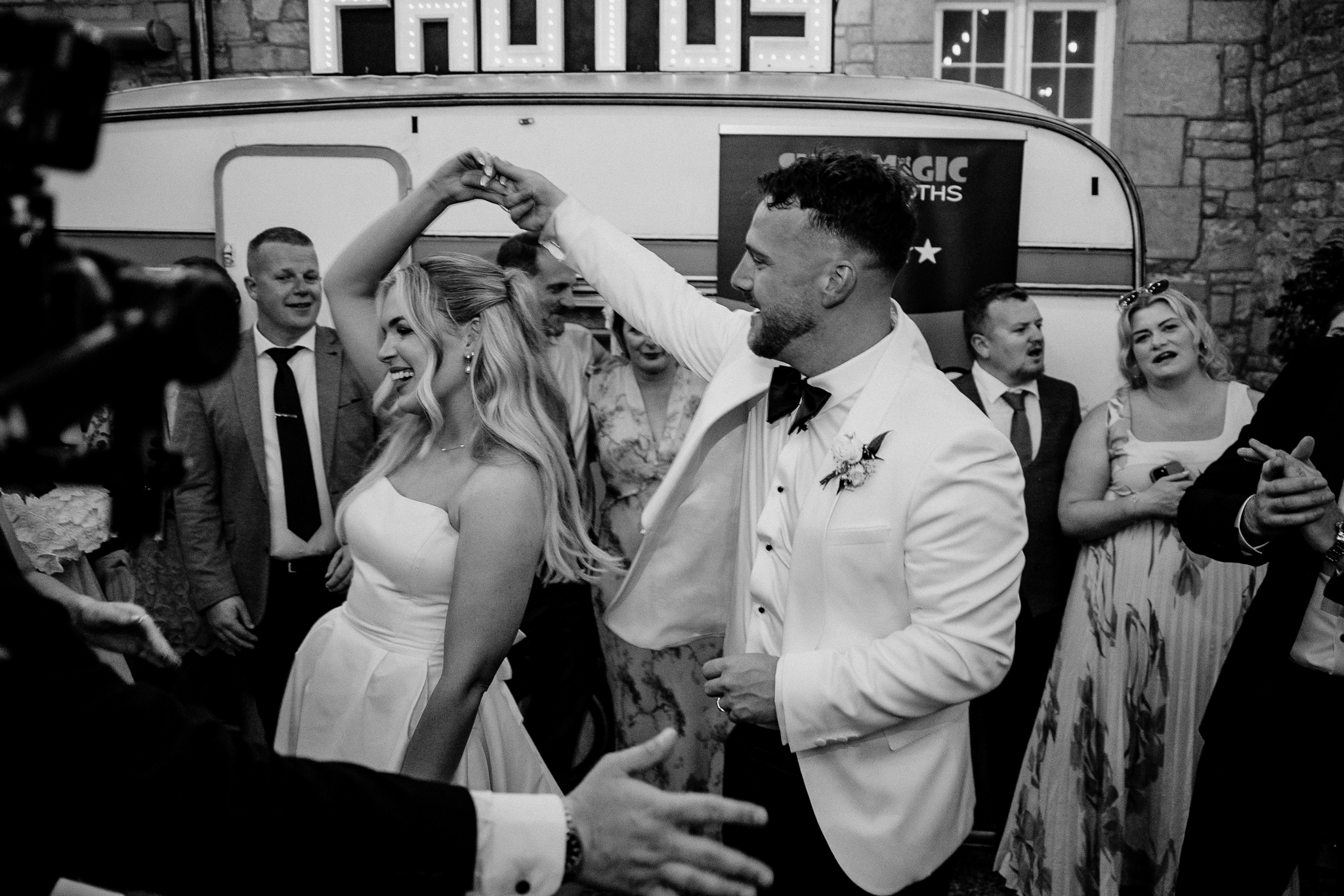 Black and white close-up of bride and groom dancing in the courtyard at Markree Castle