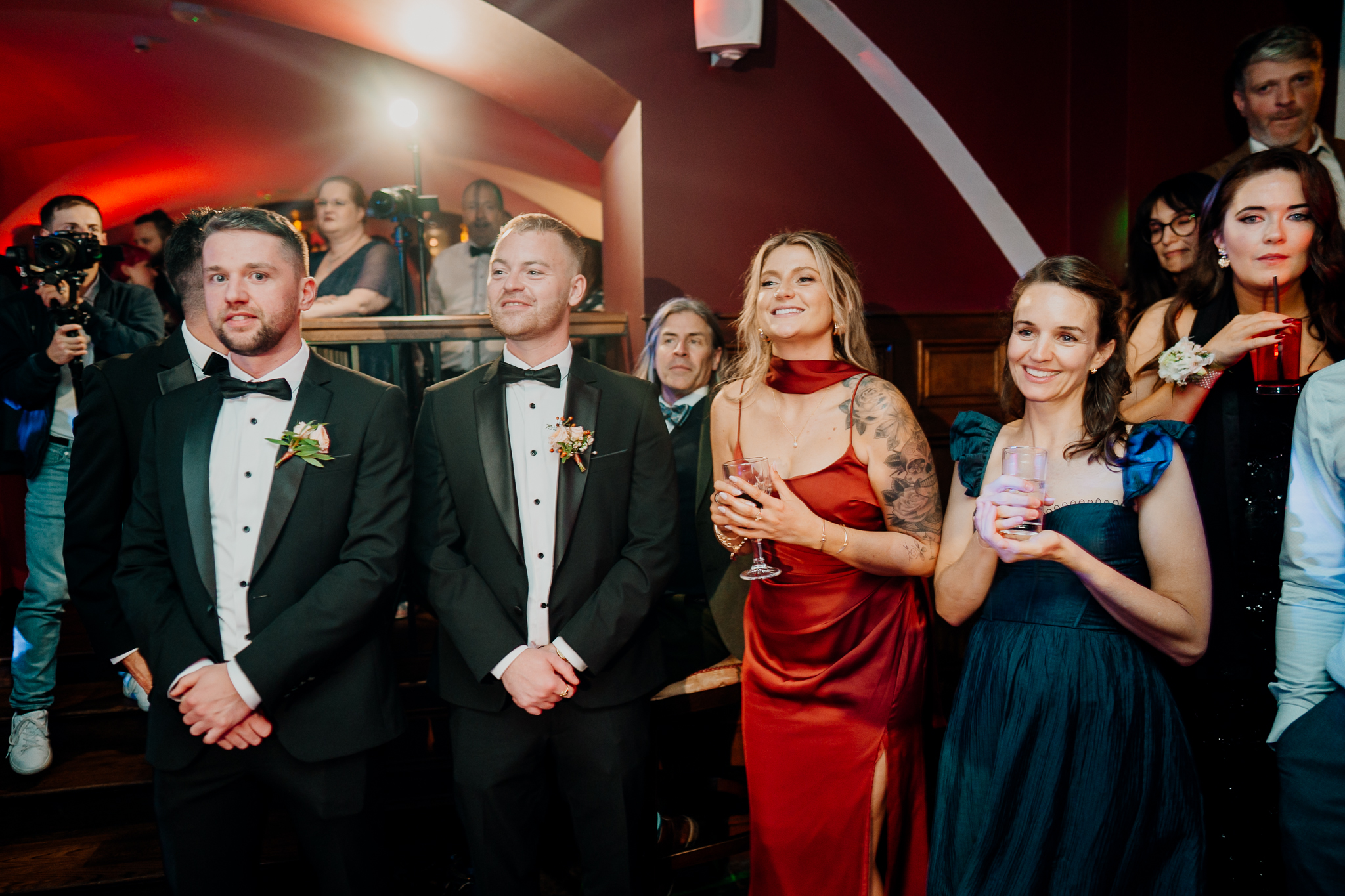 Wedding guests smiling and celebrating together on the indoor dance floor at Markree Castle.