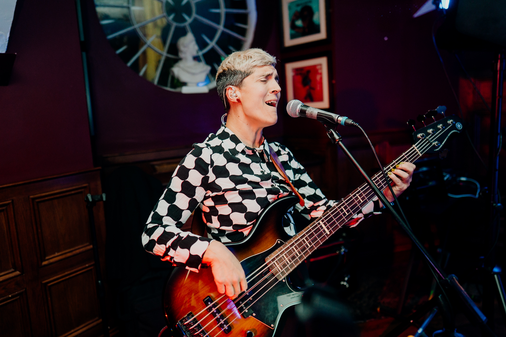 Female wedding singer performing into a microphone during the evening reception at Markree Castle.