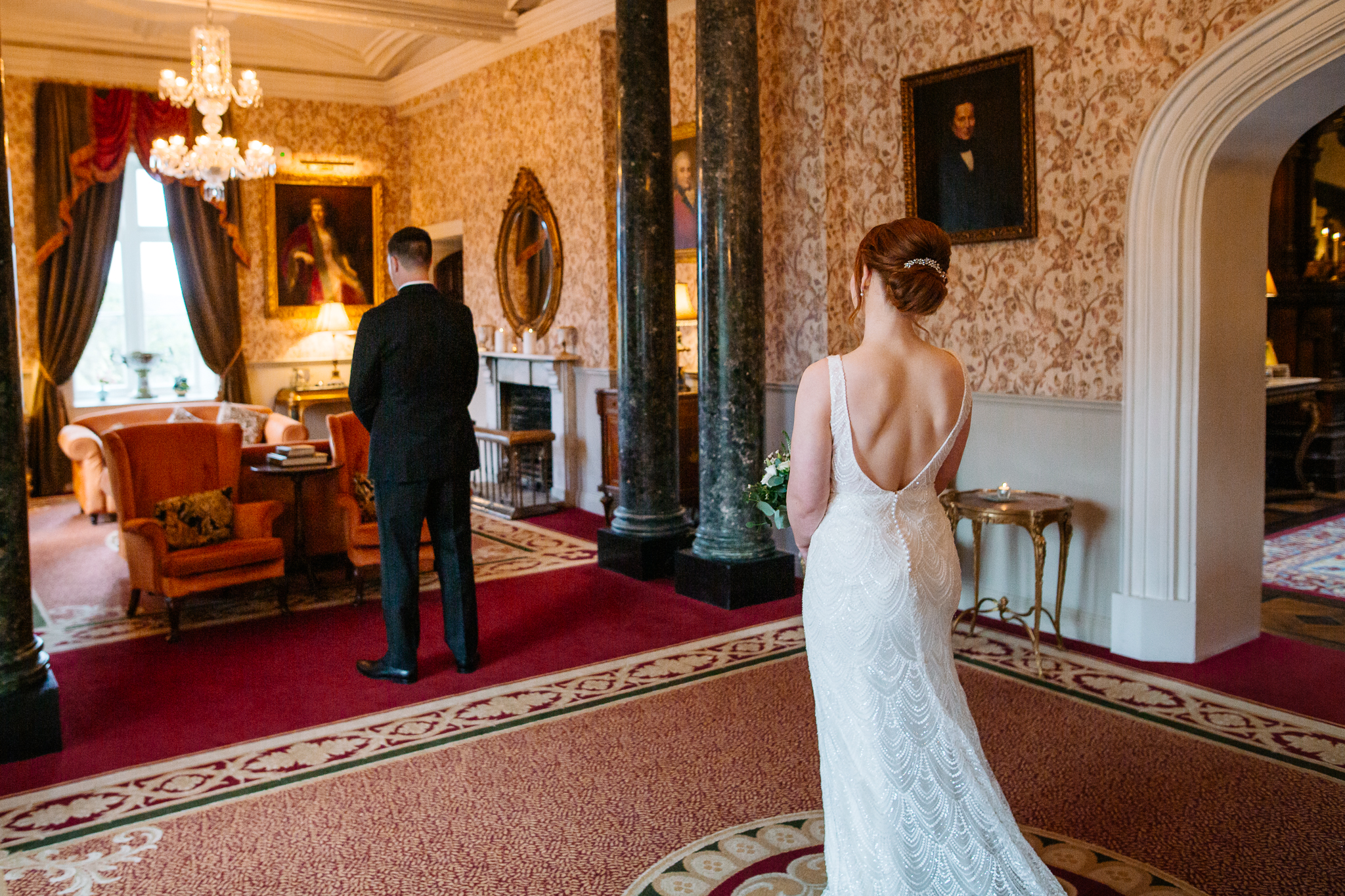 Bride and groom during a first look in the Grand Hall at Markree Castle