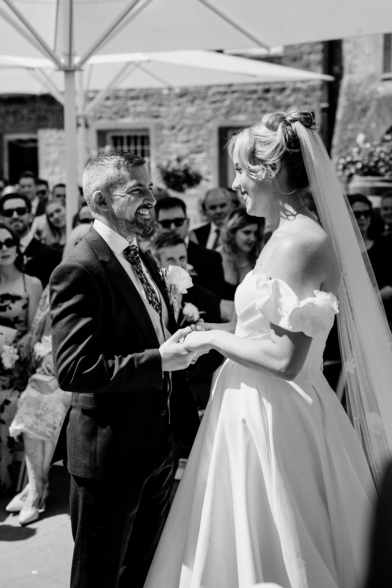 Black and white photograph of a bride and groom facing each other during their outdoor ceremony at Markree Castle.