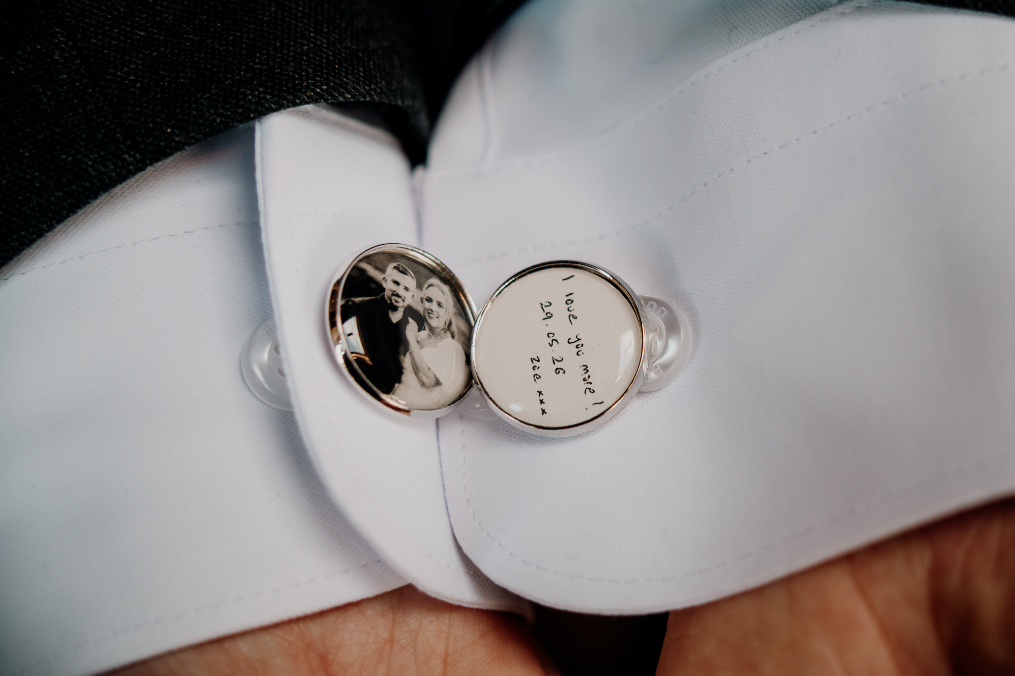 Personalised silver groom cufflinks photographed on a white shirt during wedding preparations at Markree Castle.