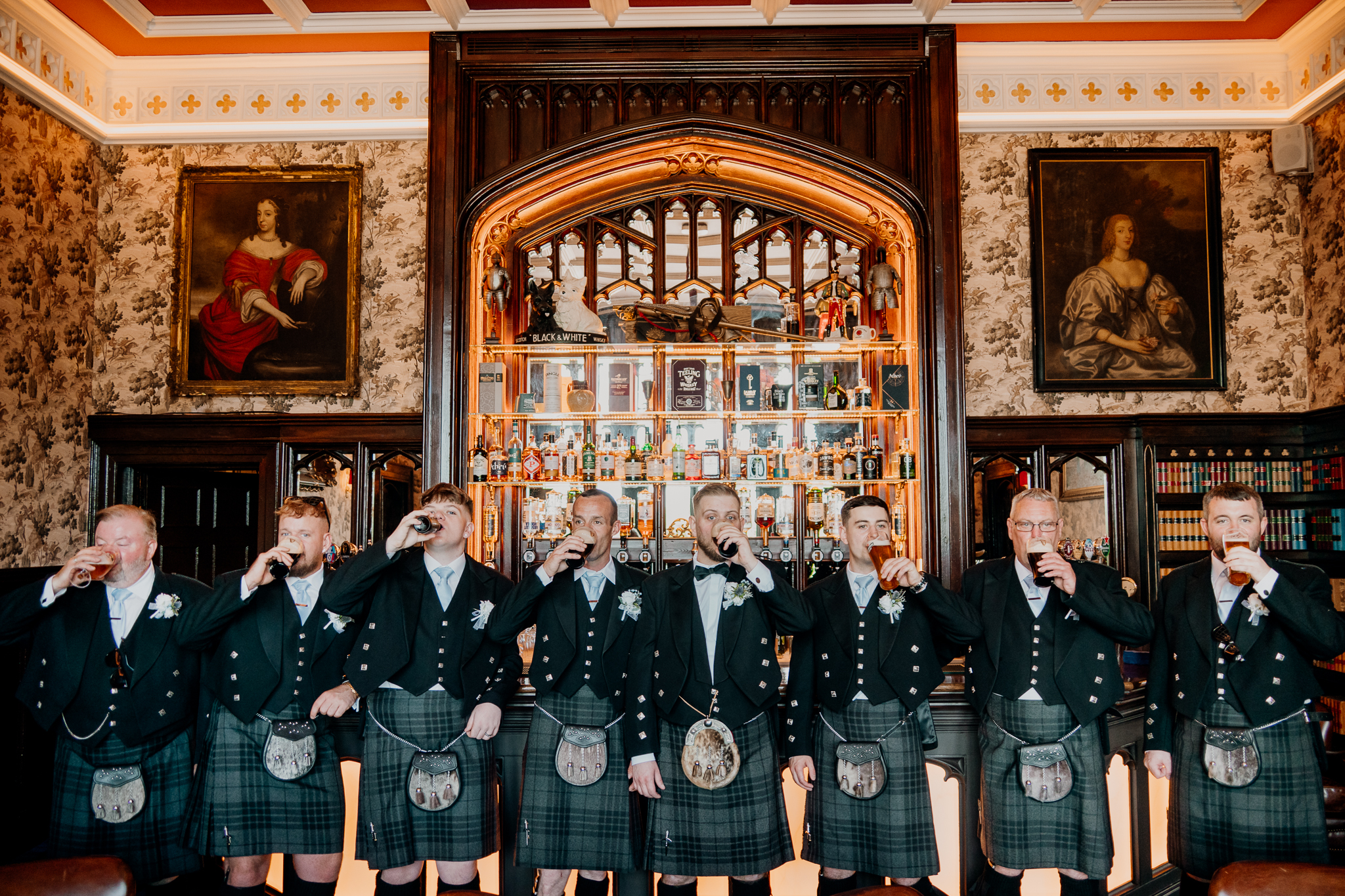 Groom and groomsmen posing together inside Markree Castle during the wedding morning preparations.