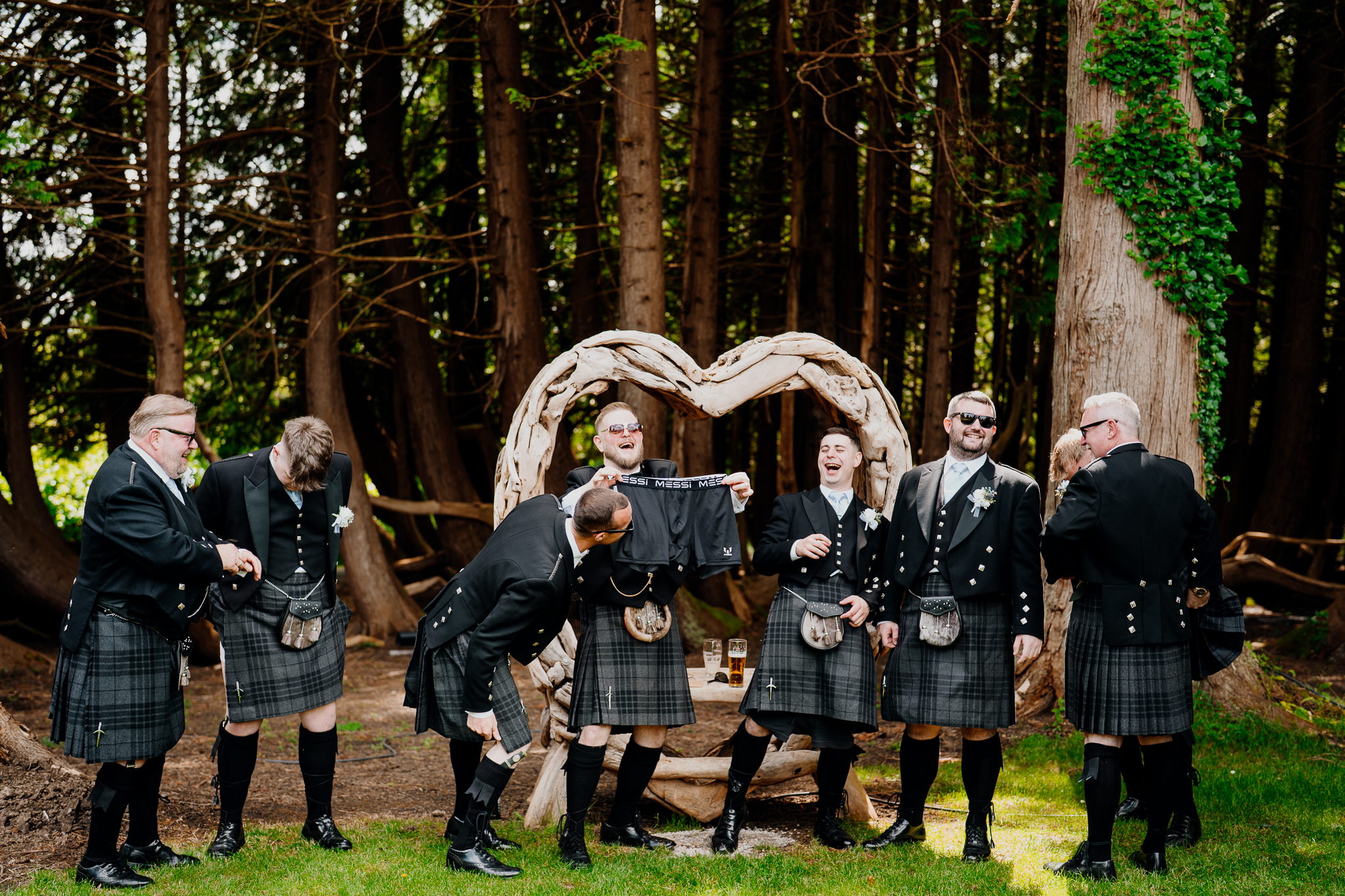 Groom reading a personal letter outdoors at Markree Castle during his wedding morning preparations.
