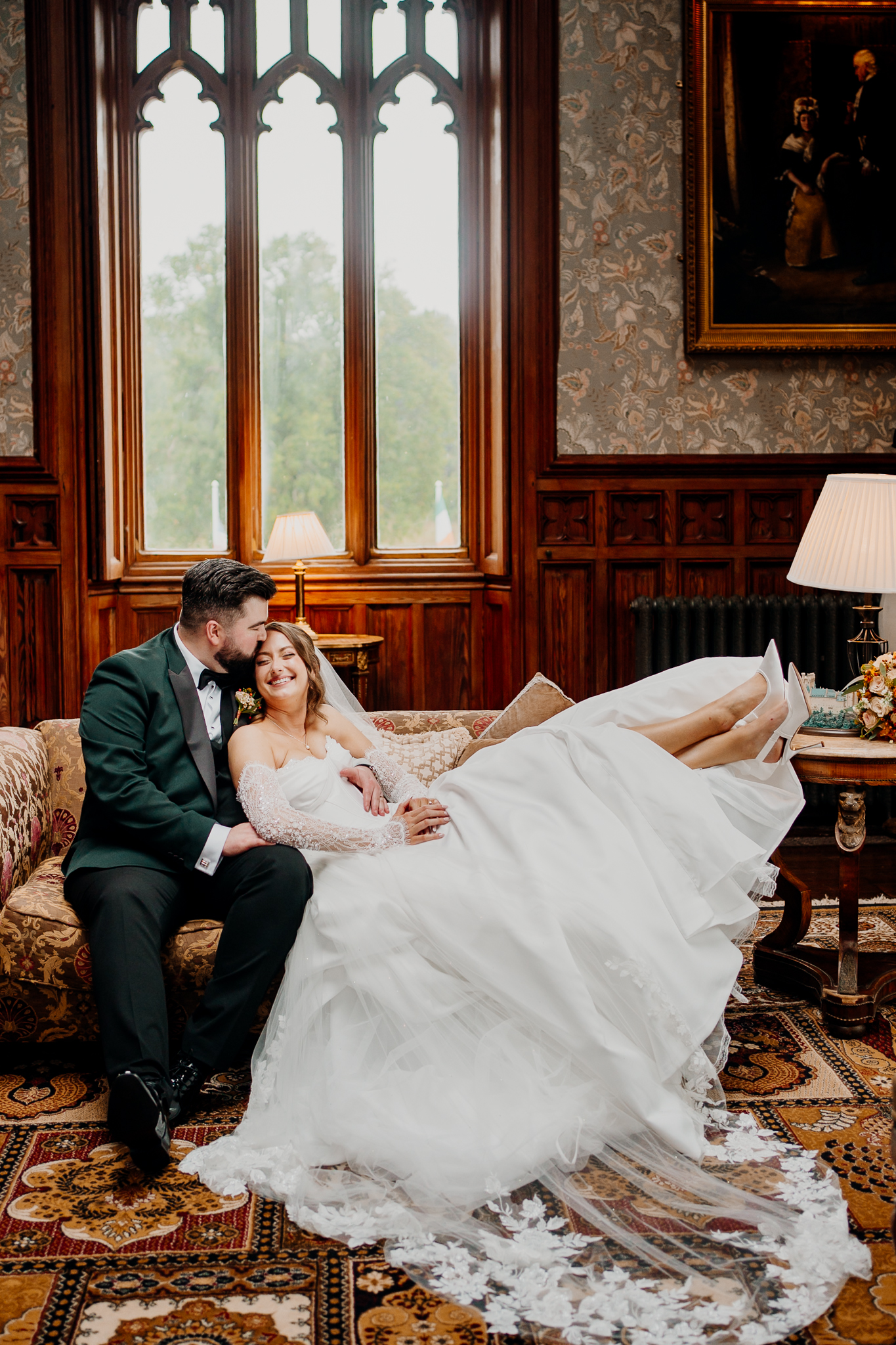 An indoor wedding group photograph at Markree Castle, showing family and friends gathered in the Billiard Room for Amy and Anthony's wedding celebrations.