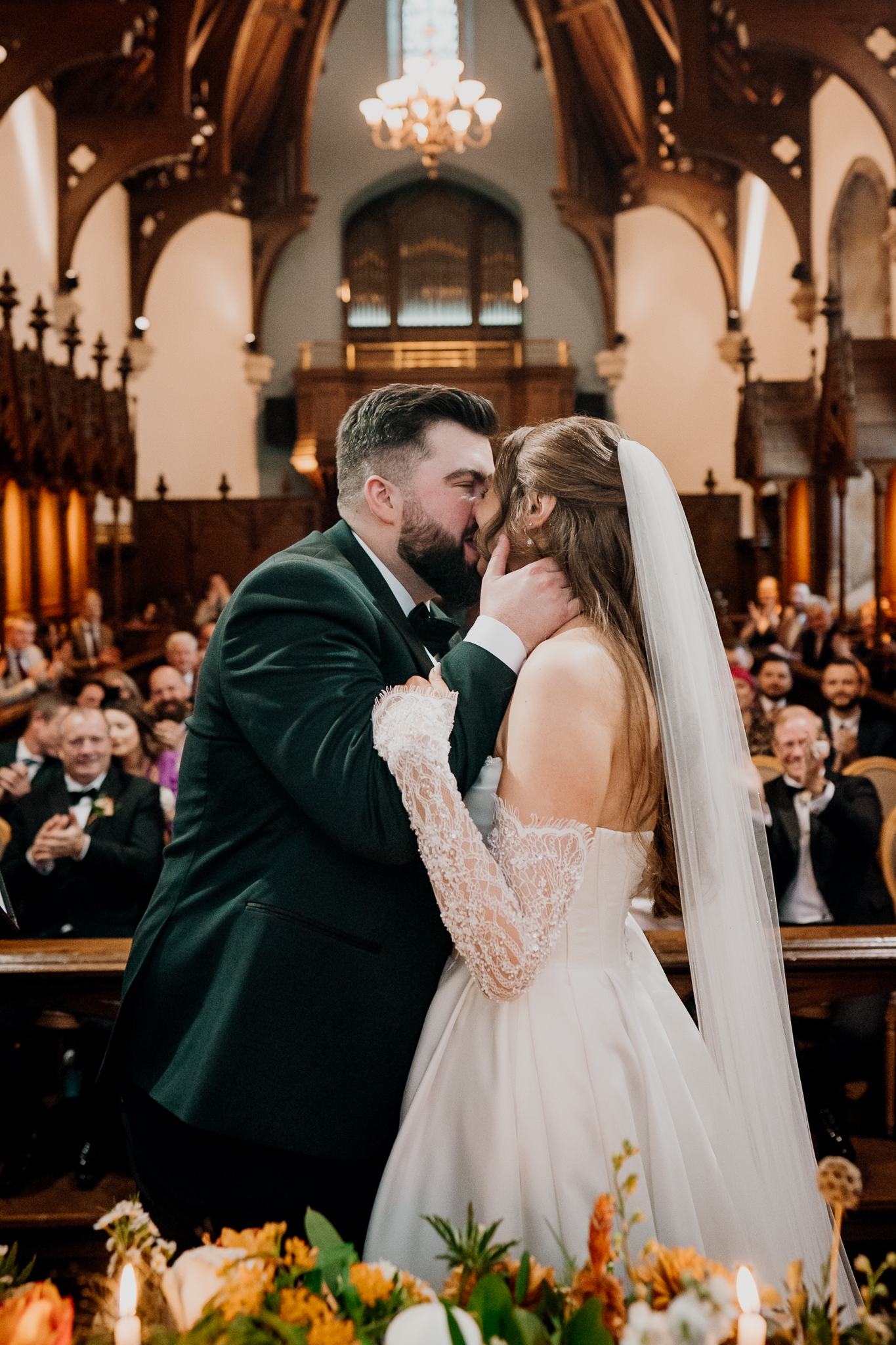Bride and groom sharing their first kiss as newlyweds inside the historic chapel at Markree Castle.