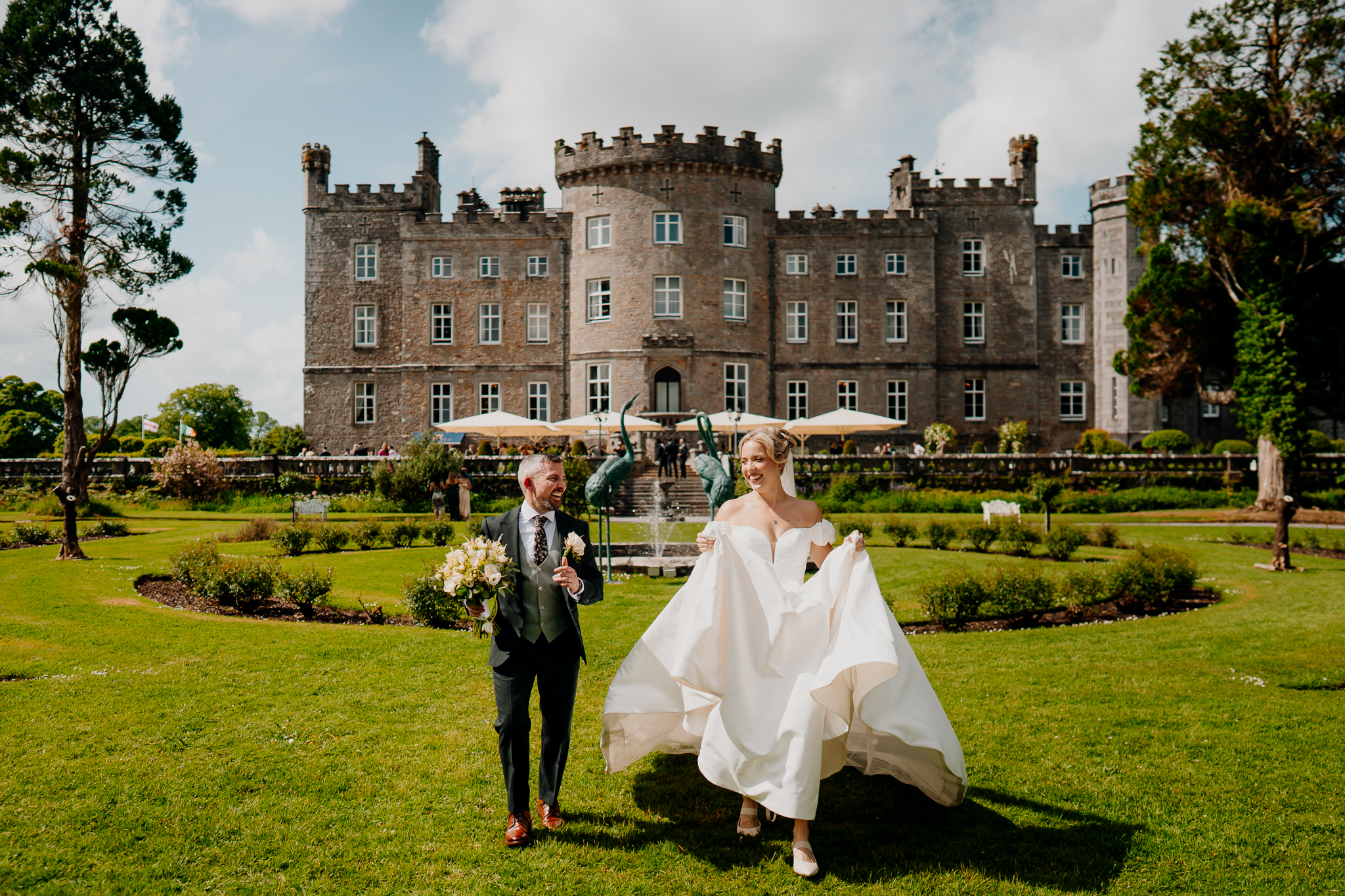 Zoe and Mark posing together on the lawn in front of the historic Markree Castle in County Sligo, Ireland.