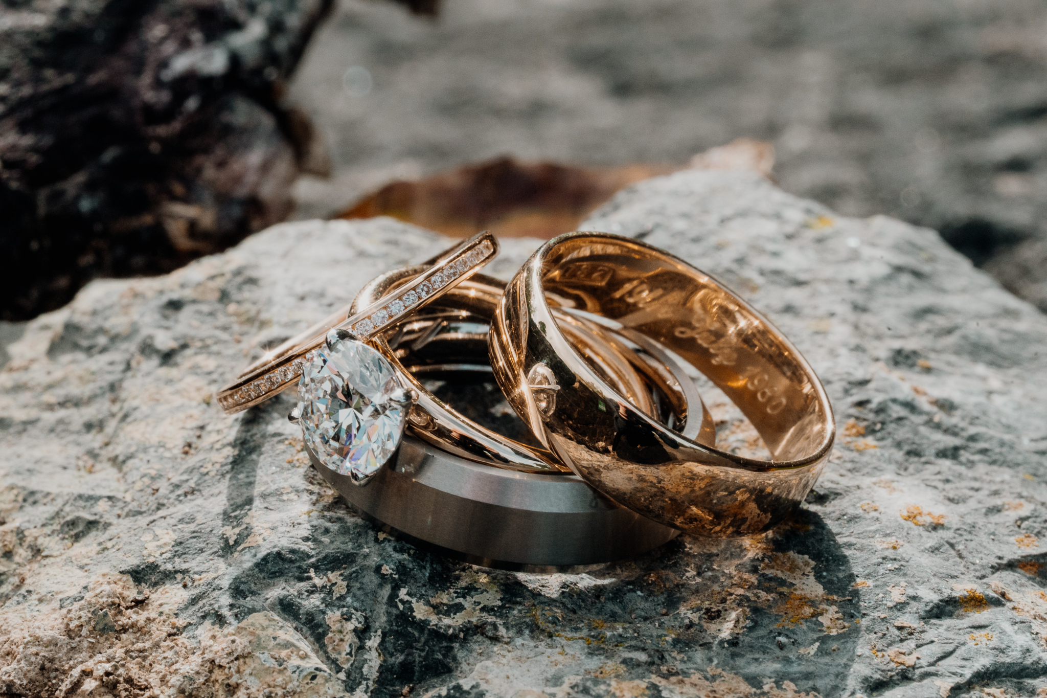 Wedding rings arranged on a rustic stone surface at Markree Castle in Sligo, Ireland.