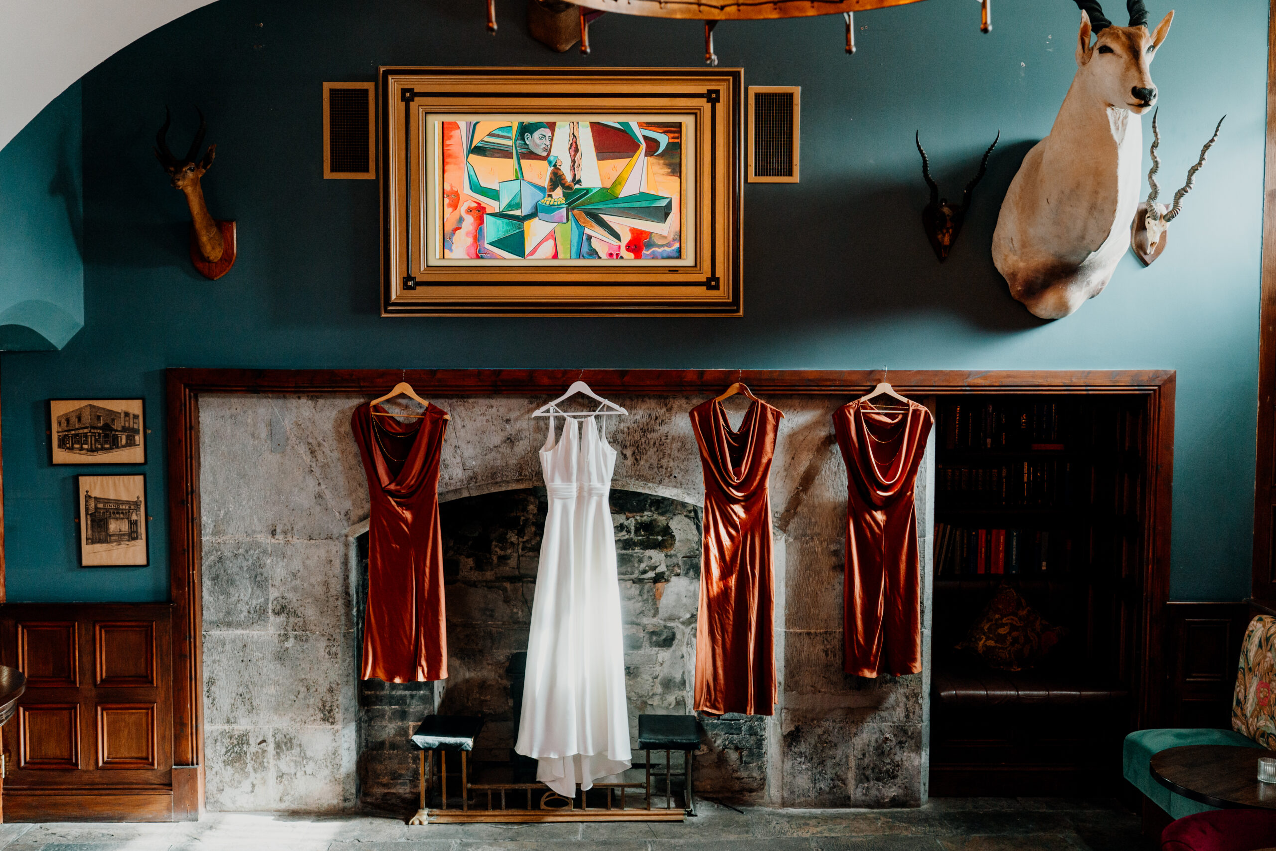 Bride and bridesmaids dresses displayed in the Gin Bar at Markree Castle