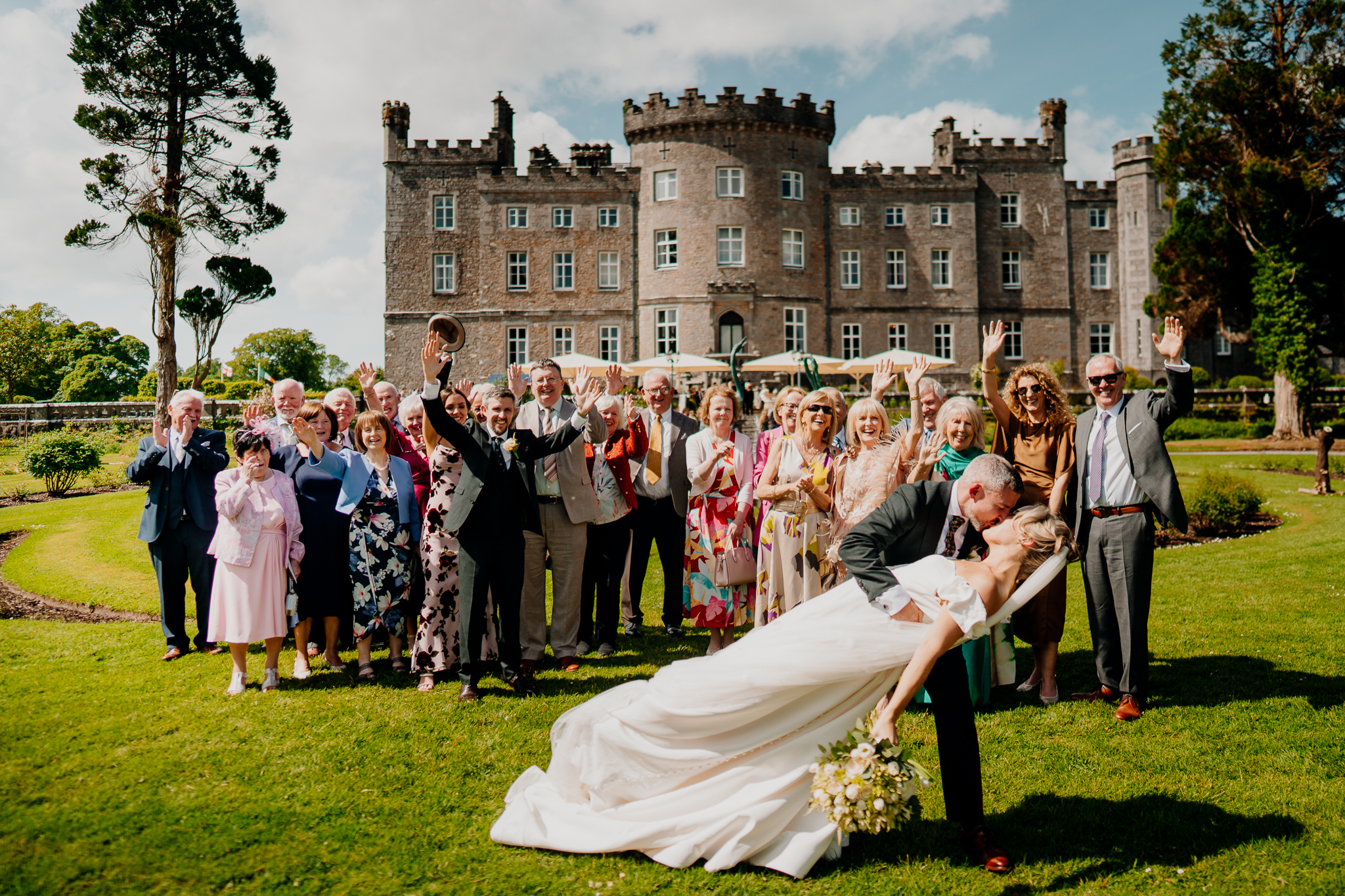 Large family wedding group portrait celebrating in front of the historic Markree Castle in County Sligo, Ireland.