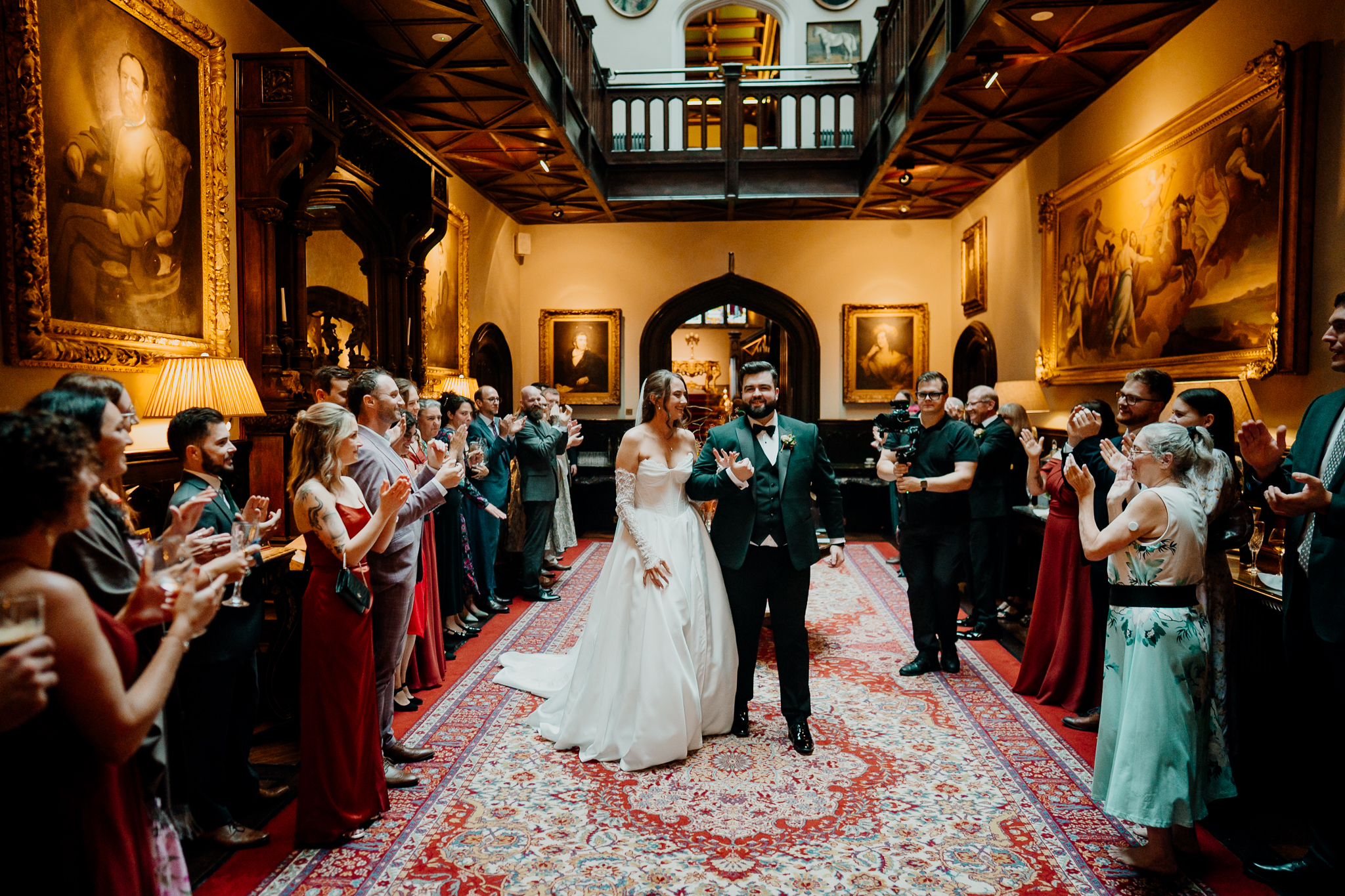 Wide view of wedding guests gathered in the elegant reception room at Markree Castle, County Sligo.