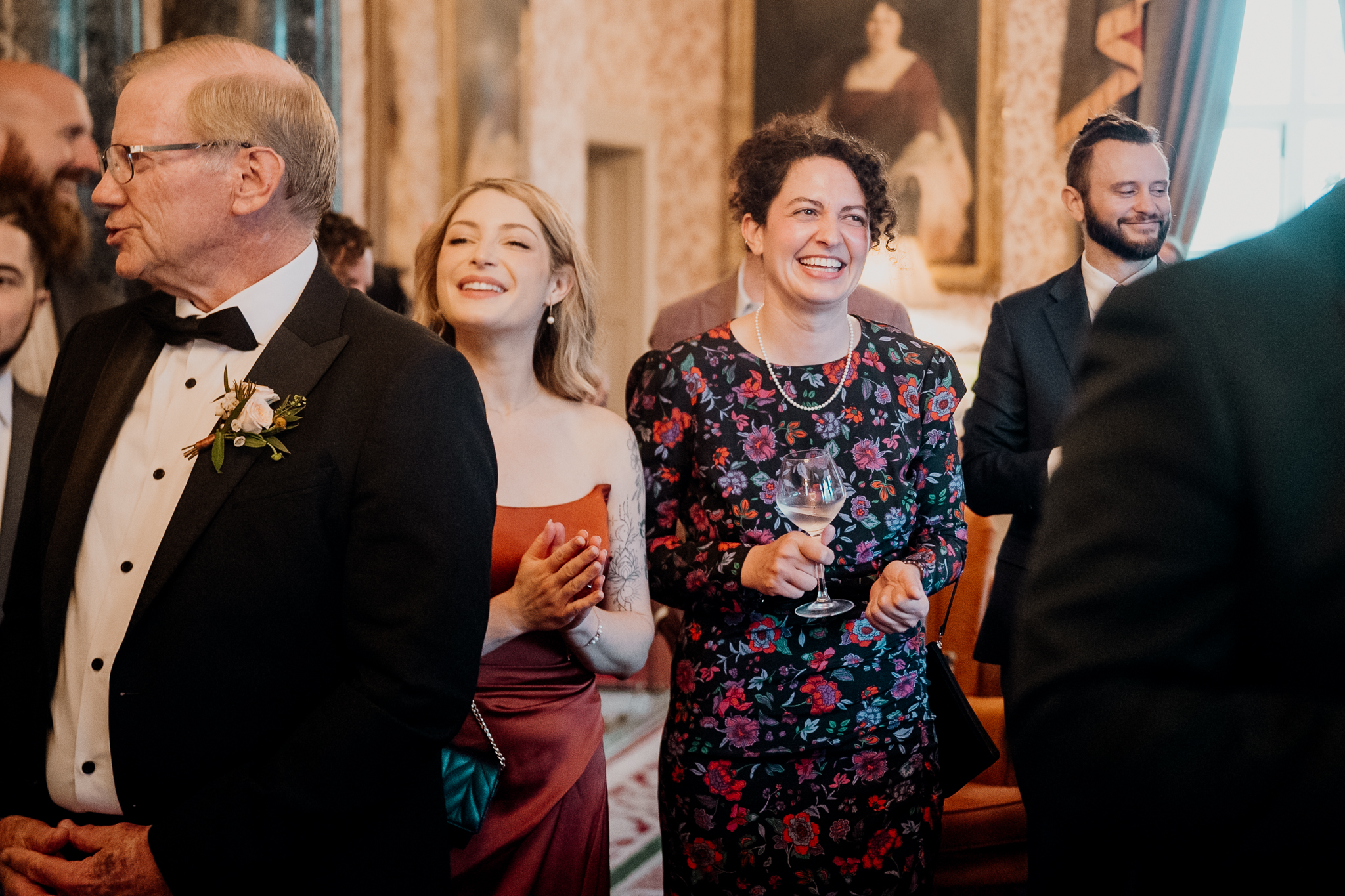 Two smiling female wedding guests celebrating together during an indoor reception at Markree Castle.
