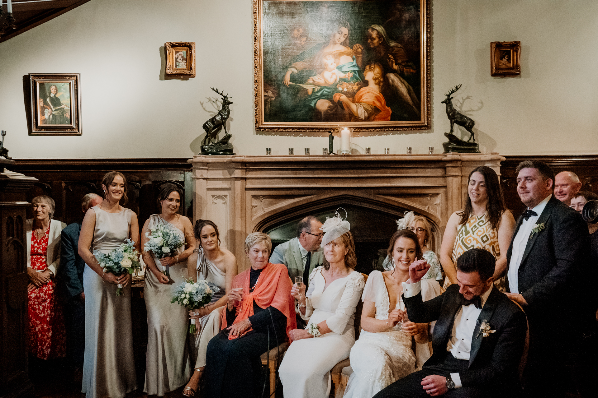 Wedding guests reacting during speeches inside Markree Castle