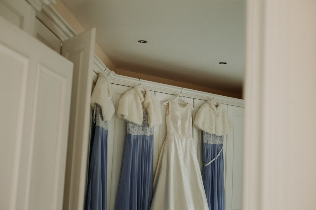 A white towel hanging on the wall